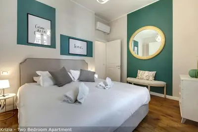 Letto o letti in una camera di Bice & Krizia Apartments by Mamo Florence