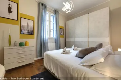 Letto o letti in una camera di Bice & Krizia Apartments by Mamo Florence