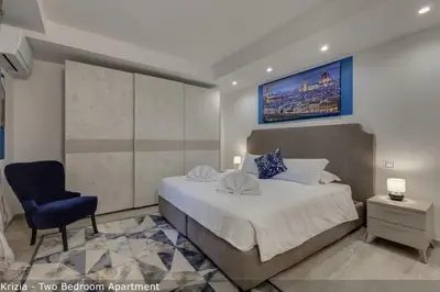 Letto o letti in una camera di Bice & Krizia Apartments by Mamo Florence