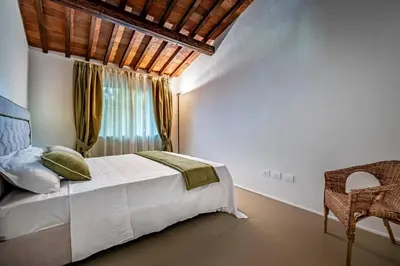 Letto o letti in una camera di YiD Cozy House in Fiesole with Jacuzzi
