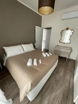 Letto o letti in una camera di Luminoso appartamento fiorentino