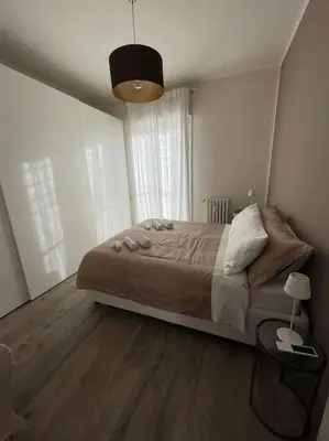 Letto o letti in una camera di Luminoso appartamento fiorentino