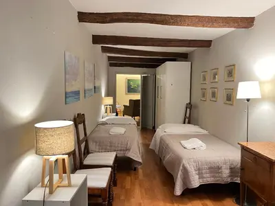 Letto o letti in una camera di Cozy Duomo Dante Uffizi Firenze central