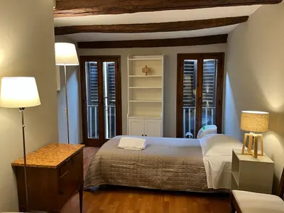 Letto o letti in una camera di Cozy Duomo Dante Uffizi Firenze central