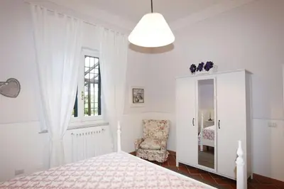 Letto o letti in una camera di Appartamento La Violetta