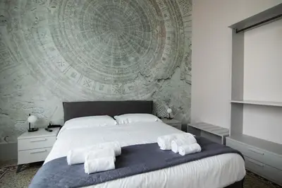 Letto o letti in una camera di Galileo Galilei - Superior Home in Florence