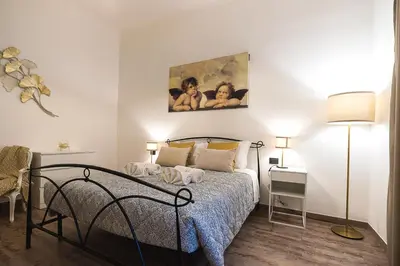 Letto o letti in una camera di TINA HOUSE FLORENCE