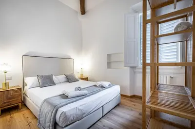 Letto o letti in una camera di YiD wonderful balcony view on Florence