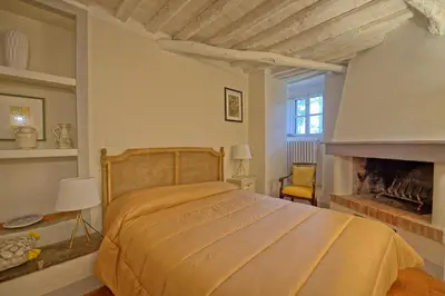 Letto o letti in una camera di Castello di Montegufoni by PosarelliVillas