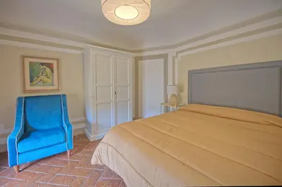 Letto o letti in una camera di Castello di Montegufoni by PosarelliVillas