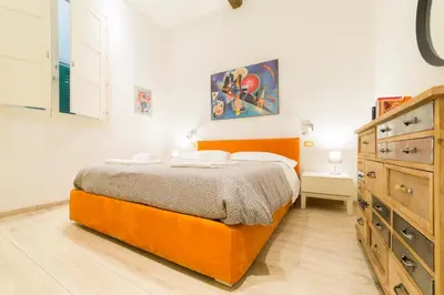 Letto o letti in una camera di Gallery Flat - S. Maria Novella