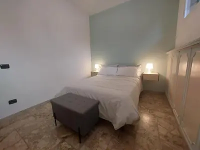 Letto o letti in una camera di Del Greco house Careggi