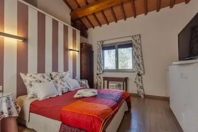 Letto o letti in una camera di Villa privata con piscina alle porte di Firenze