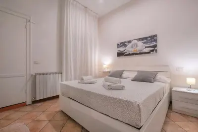 Letto o letti in una camera di Wine Apartments Florence Moscato