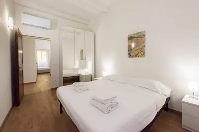 Letto o letti in una camera di Uffizi 3 bedrooms by Mmega