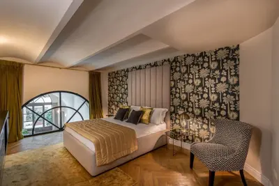 Letto o letti in una camera di Duomo Penthouse Luxury Apartment In Florence By Palazzo Pazzi Vitali