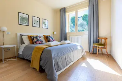 Letto o letti in una camera di Gladys, appartamento con vista a Fiesole