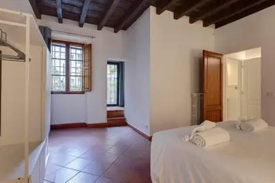 Letto o letti in una camera di Ardiglione Apartment by Mamo Florence