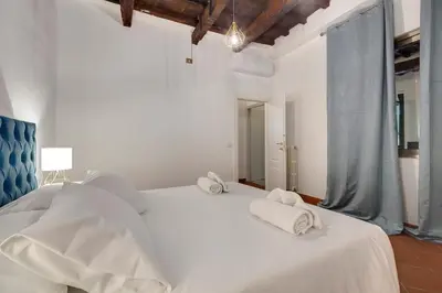 Letto o letti in una camera di Ardiglione Apartment by Mamo Florence