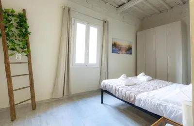 Letto o letti in una camera di Stazione - Arno River apartment