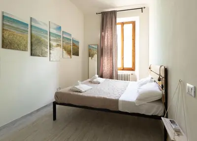 Letto o letti in una camera di Stazione - Arno River apartment
