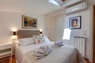 Letto o letti in una camera di Poggio Imperiale Apartment by Mamo Florence