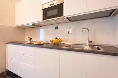 Cucina o angolo cottura di Keys of Italy - Monaco 9 - 2 bedrooms flat nearby the Train Station