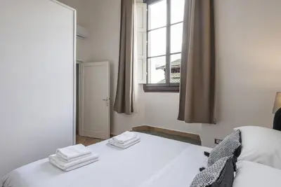 Letto o letti in una camera di UNYCA - Florence Central Market Apartment 1