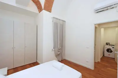 Letto o letti in una camera di CITTADELLA LUXURY APARTMENTS