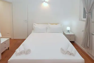 Letto o letti in una camera di CITTADELLA LUXURY APARTMENTS