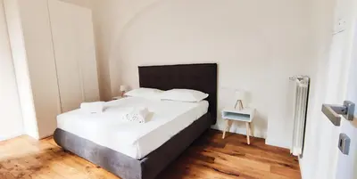 Letto o letti in una camera di CITTADELLA LUXURY APARTMENTS