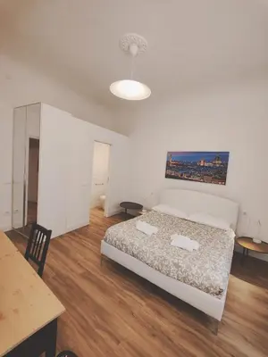 Letto o letti in una camera di Amazing Florence Rooms