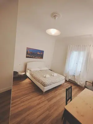Letto o letti in una camera di Amazing Florence Rooms