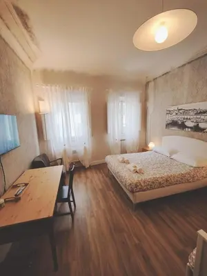 Letto o letti in una camera di Amazing Florence Rooms