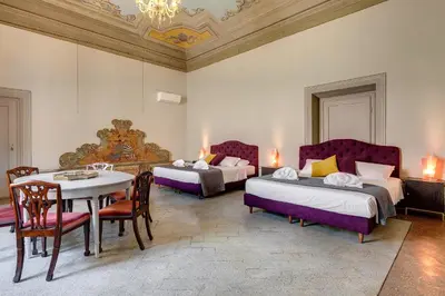 Letto o letti in una camera di Tintori Luxury Palace by Mamo Florence