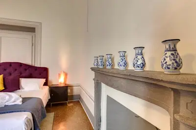 Letto o letti in una camera di Tintori Luxury Palace by Mamo Florence