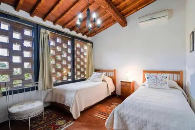 Letto o letti in una camera di Villa Olivo
