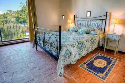 Letto o letti in una camera di Villa Olivo