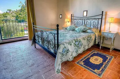 Letto o letti in una camera di Villa Olivo