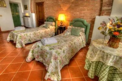 Letto o letti in una camera di Villa Luciano