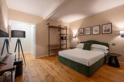 Letto o letti in una camera di Palazzina Fusi