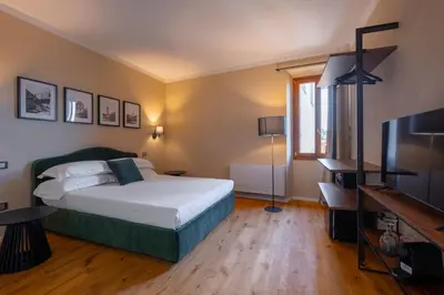 Letto o letti in una camera di Palazzina Fusi