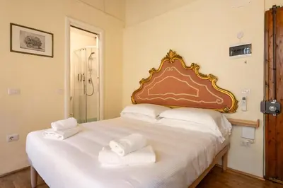 Letto o letti in una camera di Via Benedetta, 13 - Florence Charming Apartments - Florentine Gem Steps from Station - Prime Spot!