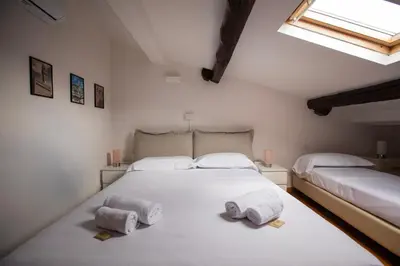 Letto o letti in una camera di Scarlatti - Boutique Home in Florence
