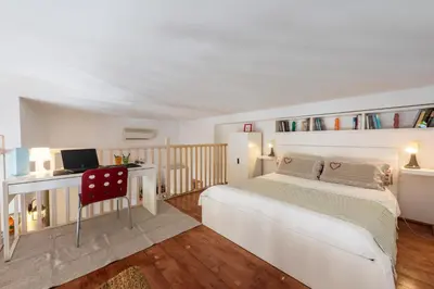 Letto o letti in una camera di Bartolommeo Scala Loft by Mmega