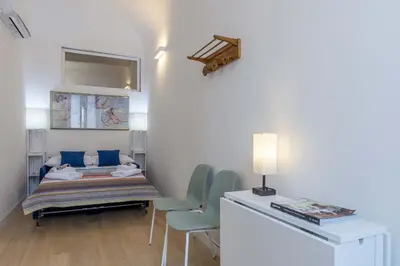 Letto o letti in una camera di Italian Experience- Atelier La Scala