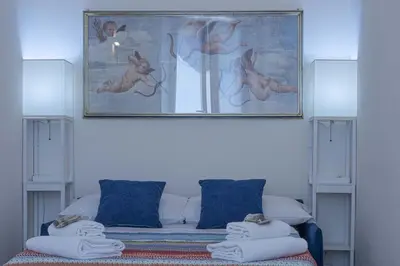 Letto o letti in una camera di Italian Experience- Atelier La Scala