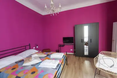 Letto o letti in una camera di Santa Croce Rainbow