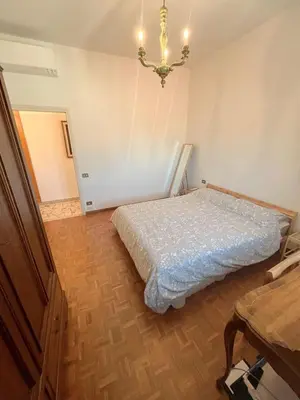 Letto o letti in una camera di Stanza singola in appartamento condiviso