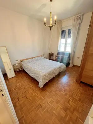 Letto o letti in una camera di Stanza singola in appartamento condiviso